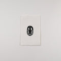 Hand-printed black and white linocut art of a confluent leaf beetle, unframed