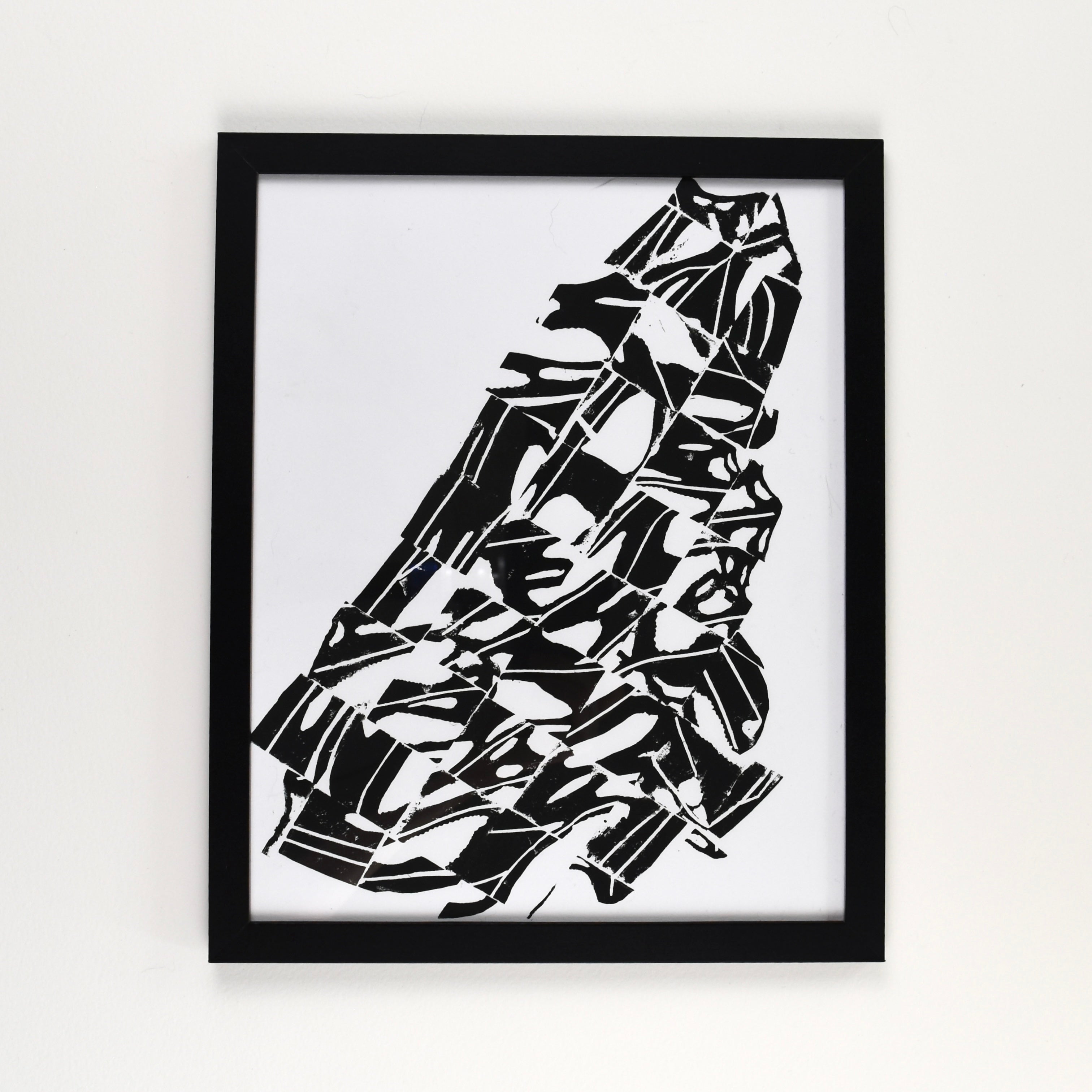 Hand-printed black and white linocut art of a fragmented gulf fritillary wing, framed