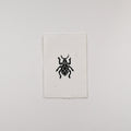 Hand-printed black and white linocut art of a jewel weevil, unframed